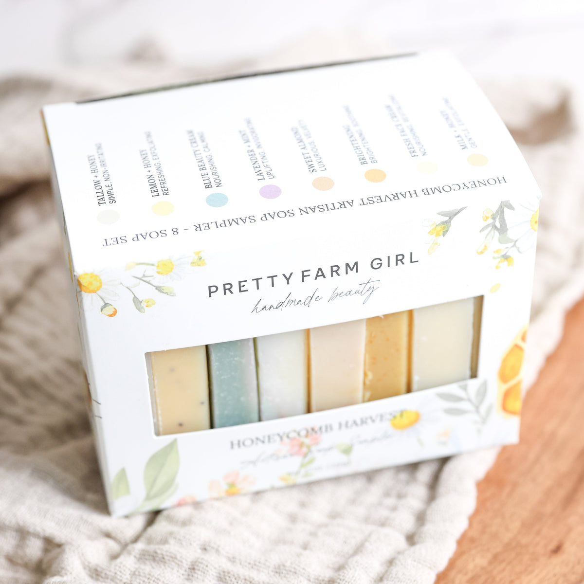 Eight 2.5oz Honeycomb Harvest Goat Milk & Tallow Soap Sampler bars in floral box packaging